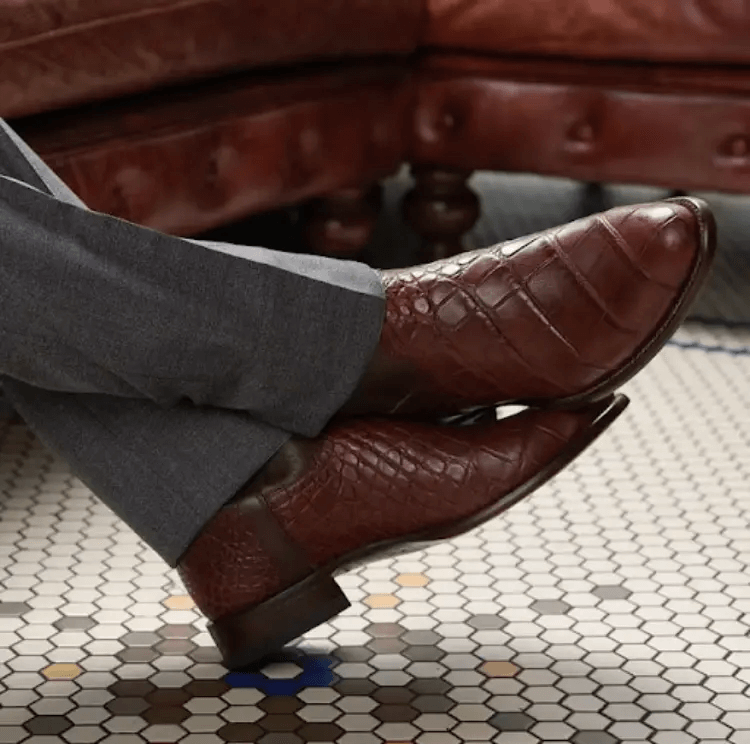 Brown cowboy boots with gray suit 